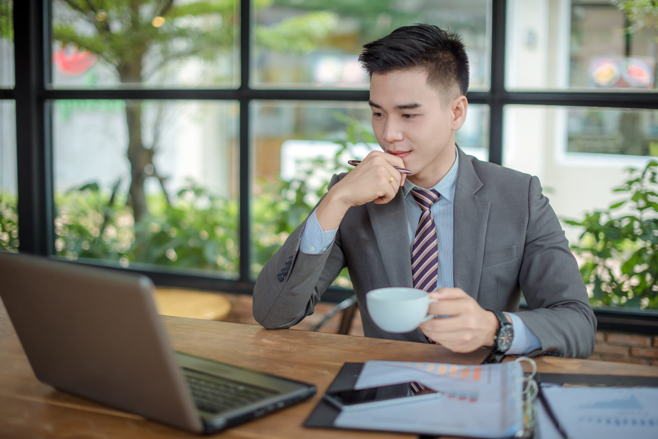 a business professional looking at a laptop