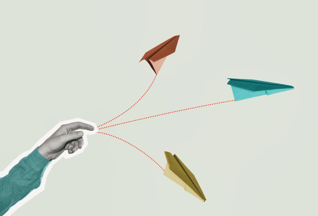 the person launches paper airplanes