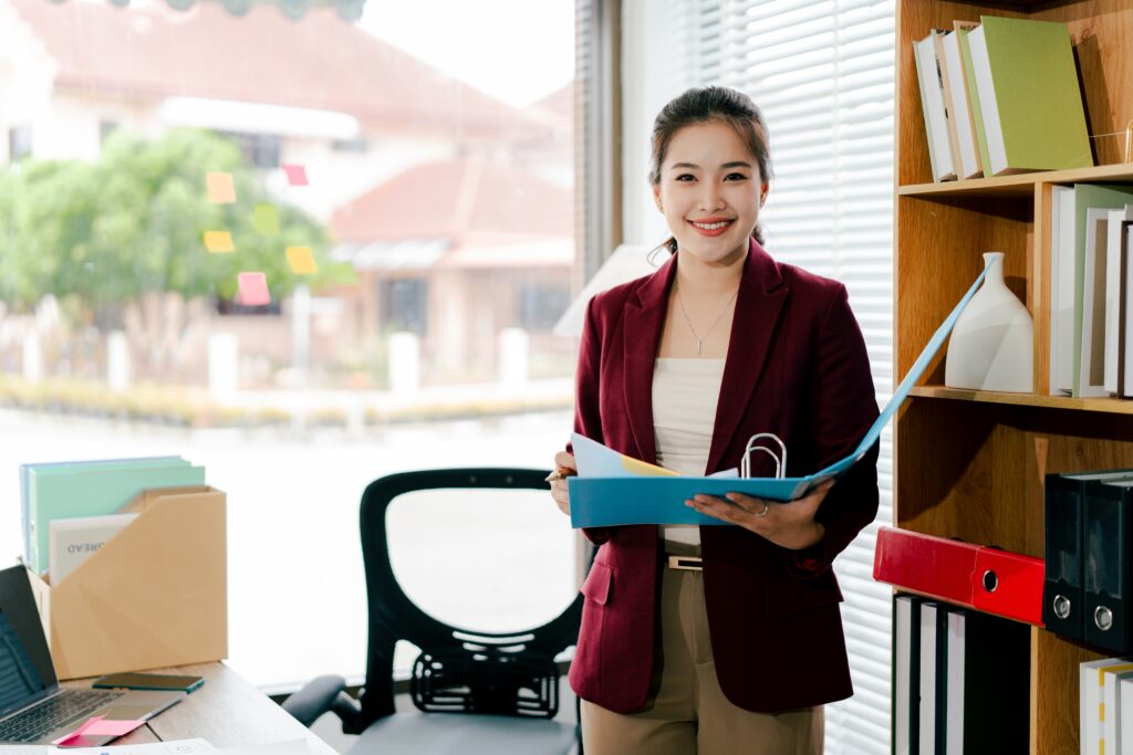 a professional accountant holding a folder