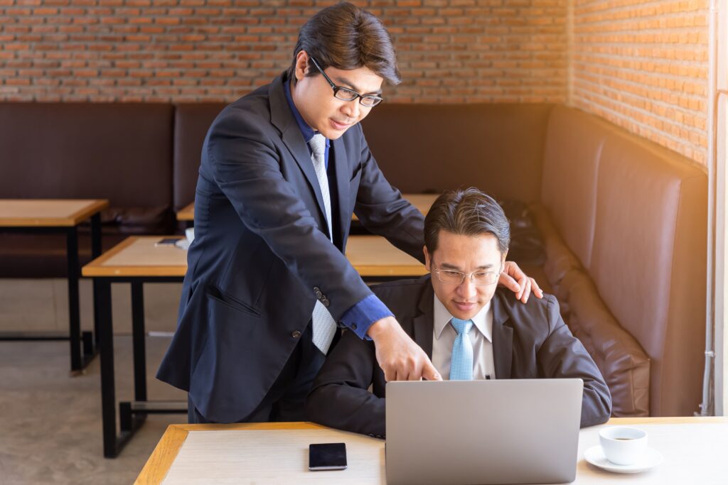 Supervisor training subordinate businessman