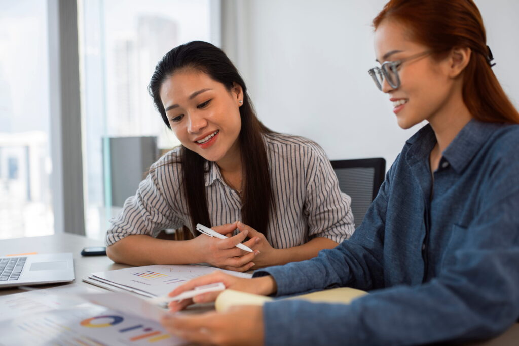 Two women working together
