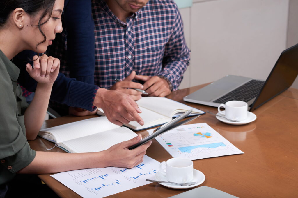 Business people discussing charts and diagrams in the office