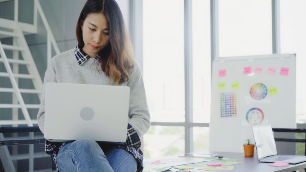 Businesswoman working at her office via laptop